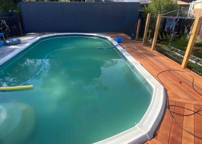 Hardwood deck built around an above-ground pool