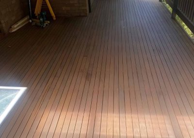 Freshly oiled hardwood balcony deck with a timber balustrade