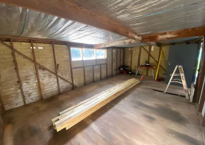 Garage interior stripped back to the frame with a foil-lined ceiling