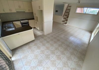 Kitchen and living area with old beige floor tiles