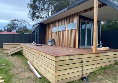 Backyard studio with a new timber deck and treated pine skirting