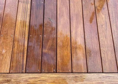 Close-up of oiled hardwood deck boards and the edge board
