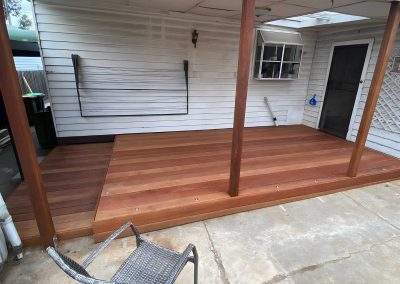 New hardwood deck with timber posts at the back of a weatherboard house