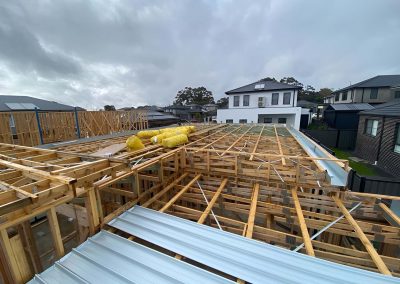 Timber wall and roof frames on a new build with metal roof sheets