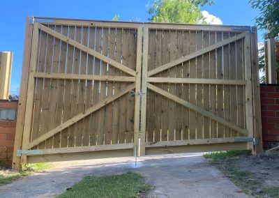 Back of treated pine double driveway gates with diagonal bracing
